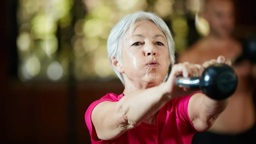 Toning Arms Without the Bulk: Is It Achievable? 1 Woman doing resistance band exercises for toned arms Waltham Abbey