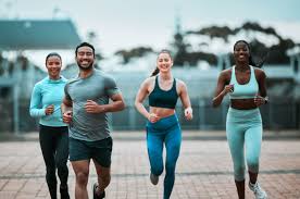 Sculpting Sleek Arms: The Essential Role of Cardio in Toning Without Bulking Up 3 image of people running to incorporate cardio Waltham Abbey exercise into their life to help tone arms and body.