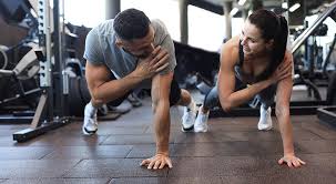 Sculpting Sleek Arms: The Essential Role of Cardio in Toning Without Bulking Up 1 Image of man and woman doing Cardio Waltham Abbey to tone their arms.